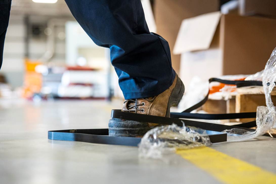 A person's foot stepping on a belt
AI-generated content may be incorrect.